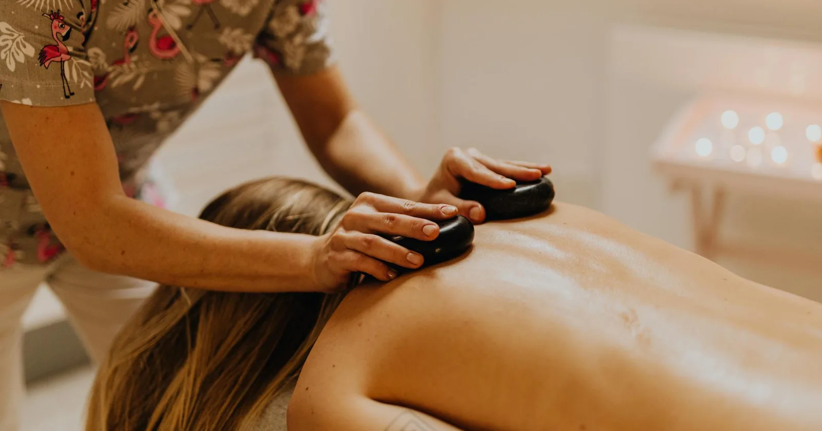 A serene hot stone massage session promoting relaxation and wellness in a spa setting.