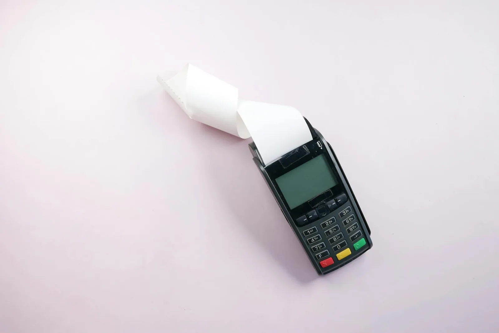Payment terminal and receipt representing the cost of a mobile massage booking.